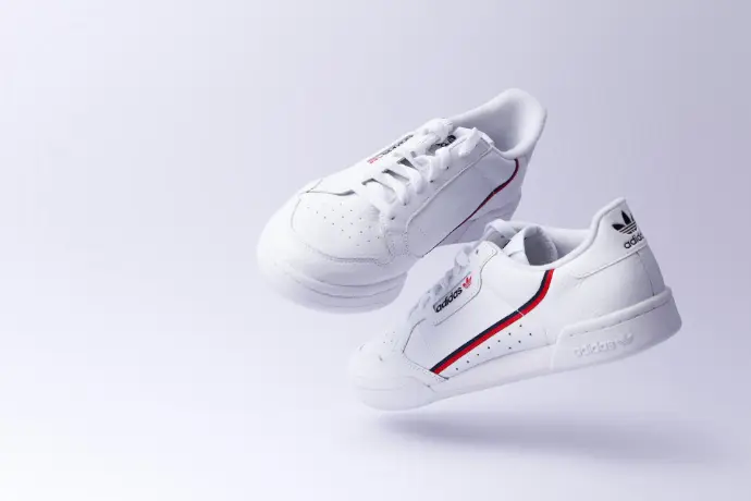 white adidas low-top sneakers